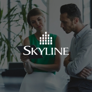 Skyline Logo With Backdrop of 2 Co-workers-2011-SkylineWealthLaunch-100